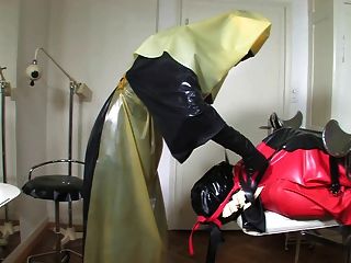 Bizarre Rubber Apron Bondage 4 Of 5