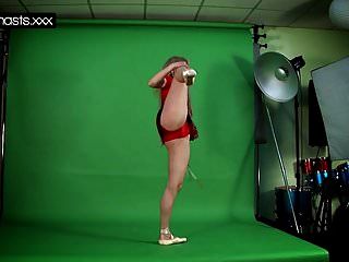 Red Dressed Gymnast Doing Spreads